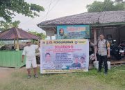 Bhabinkamtibmas Desa Lebani Pasang Baligho Himbauan, Cegah Penangkapan Ikan Pakai Setrum